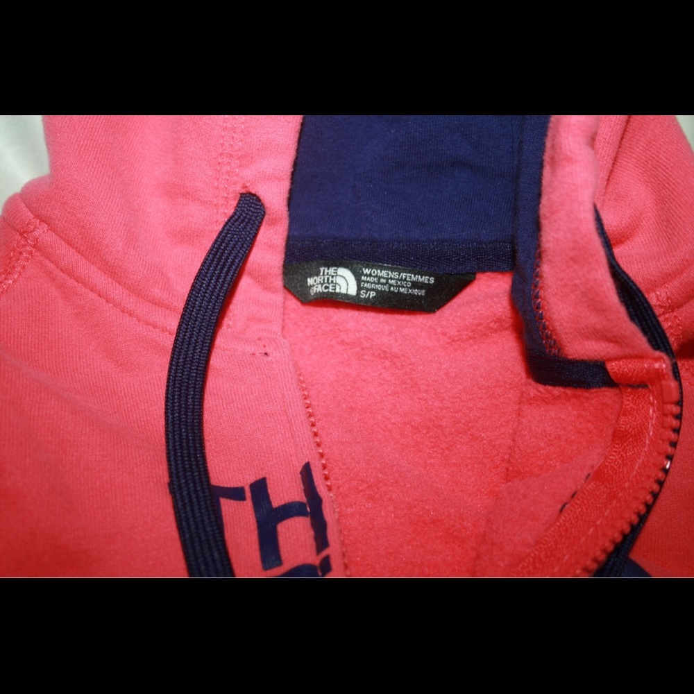 purple and salmon north face zip hoodie